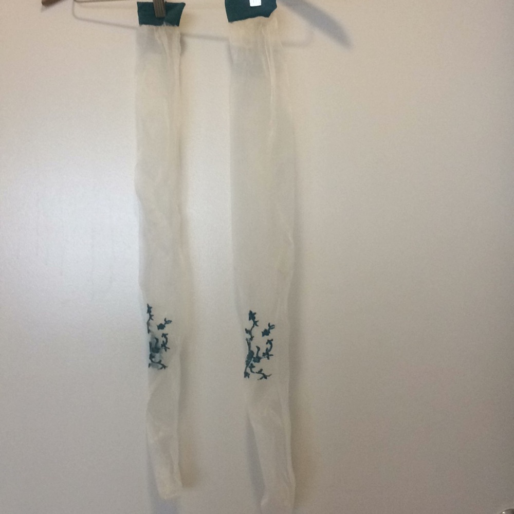 White thigh highs with blue floral pattern.